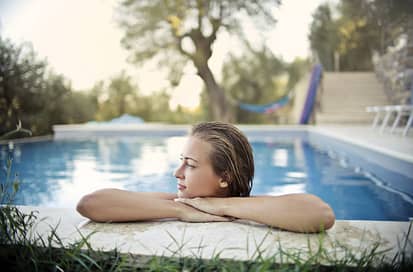 woman in backyard swimming pool